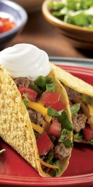 Spicy beef tacos with sour cream