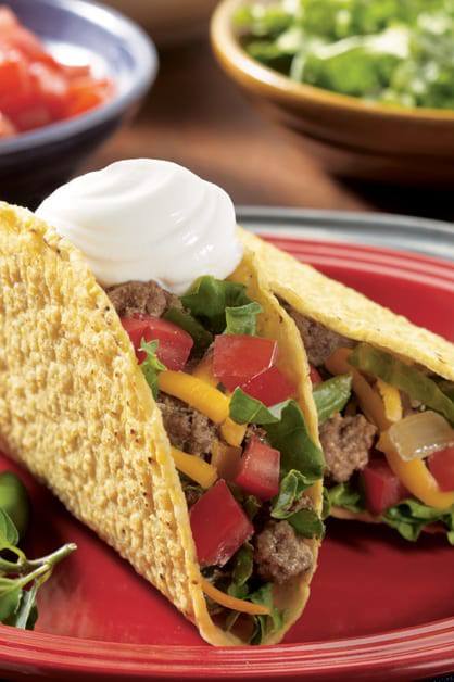 Spicy beef tacos with sour cream