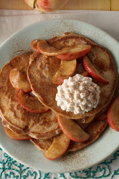 stack of cinnamon apple pancakes with cottage cheese and apples on top
