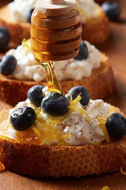 blueberry bruschetta with cottage cheese, blueberries, and honey