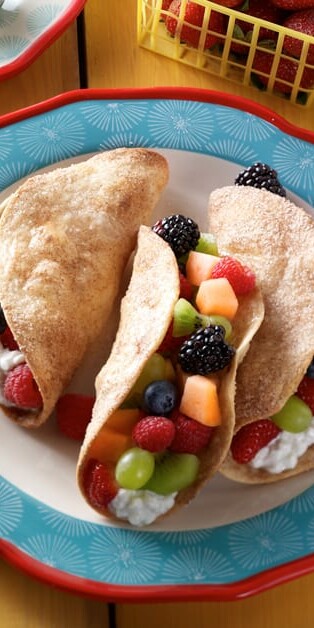 Fruit tacos with cottage cheese on plate