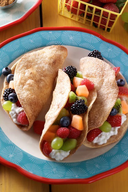 Fruit tacos with cottage cheese on plate