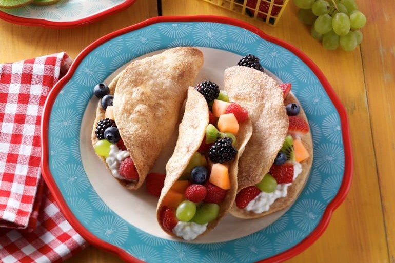 Fruit tacos with cottage cheese on plate