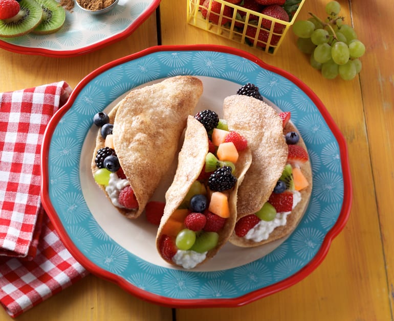 Fruit tacos with cottage cheese on plate